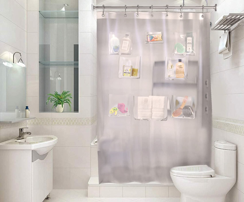 Bathroom curtain with pockets, toilet, sink, and mirror