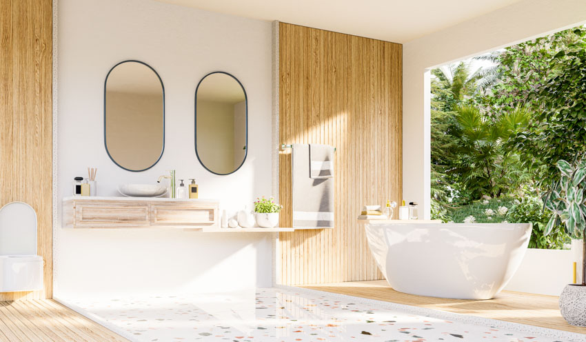 Bathroom with bamboo backsplash, floating vanity, mirror, tub, and window