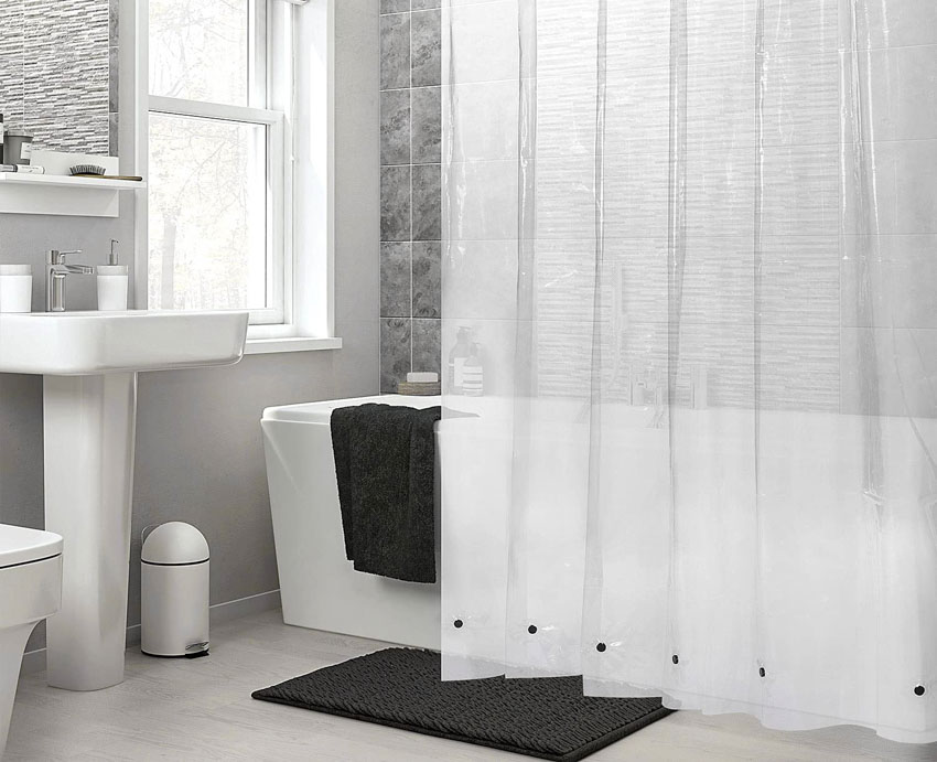 Bathroom with magnetized shower curtain, tub, sink, and windows