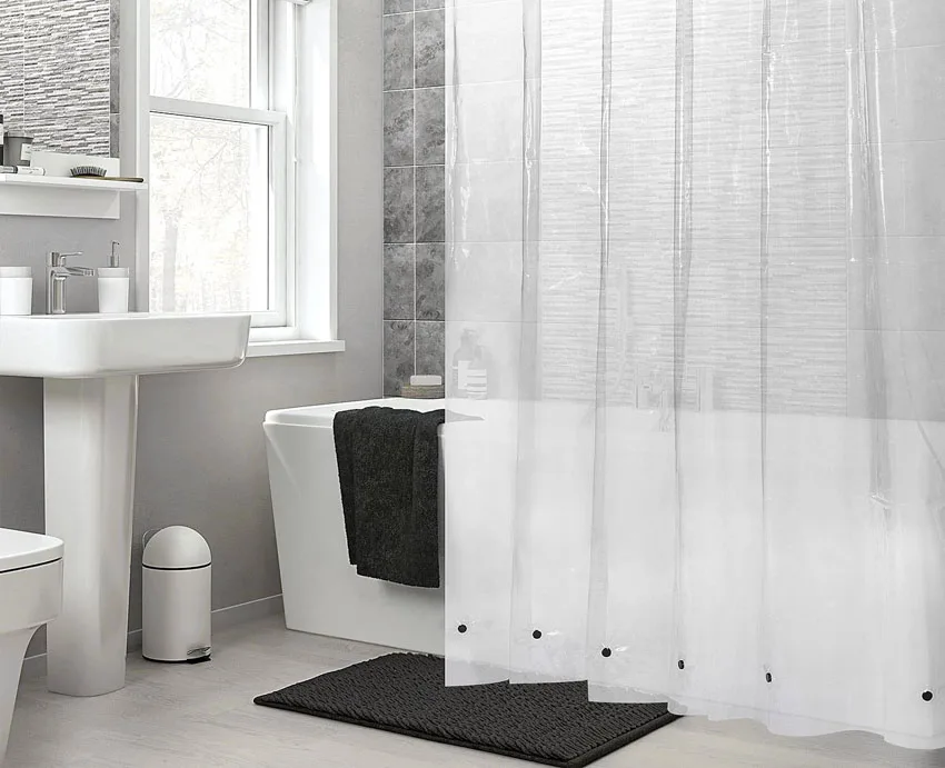 Bathroom with magnetized curtain, tub, sink, and windows