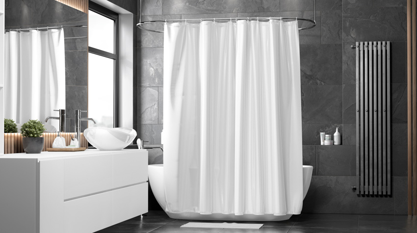 Bathroom with mildew resistant shower curtains, black tile wall, floating vanity, sink, mirror, and windows