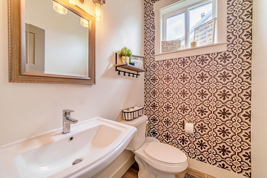 Bathroom with patterned tile accent wall