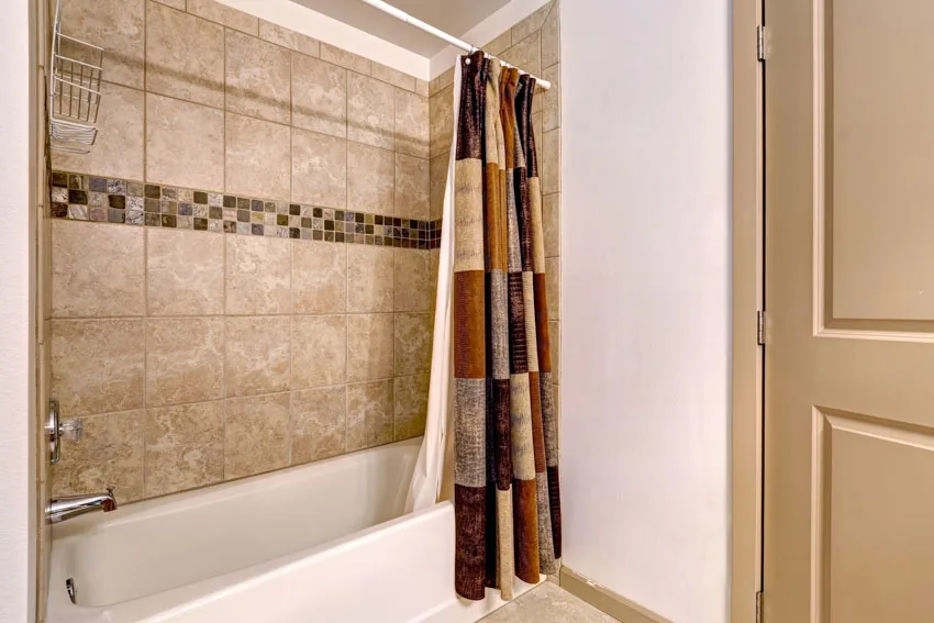 Bathroom with curtain fabric liner, and tub