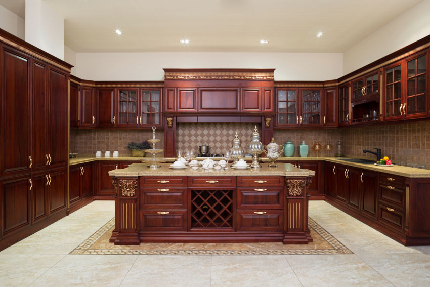 Beautiful kitchen with center island, mahogany cabinets, countertops, backsplash, and tile floors