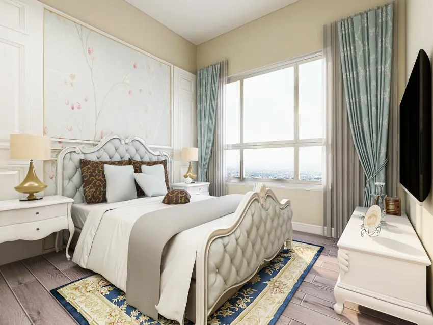 Bedroom with decorative side panel curtains, window, nightstand, lamp, headboard, rug, and wood floor