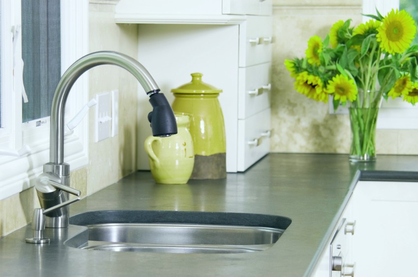 Bluestone countertop with sunflower in a vase and sink