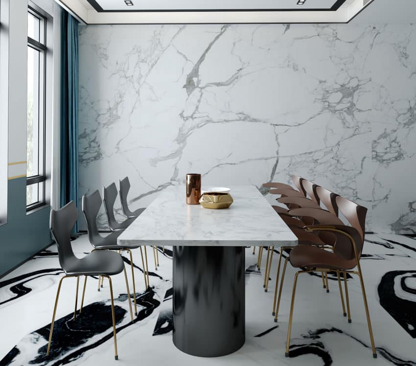 Dining room with Extra Bianco Statuario marble wall, dining table, chairs, windows, and floors