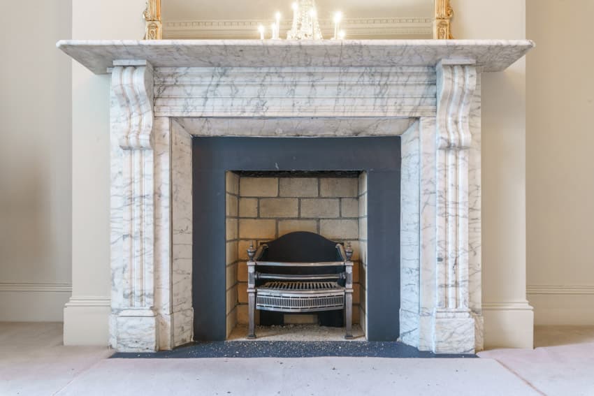Fireplace made of Statuario marble with mantel decor