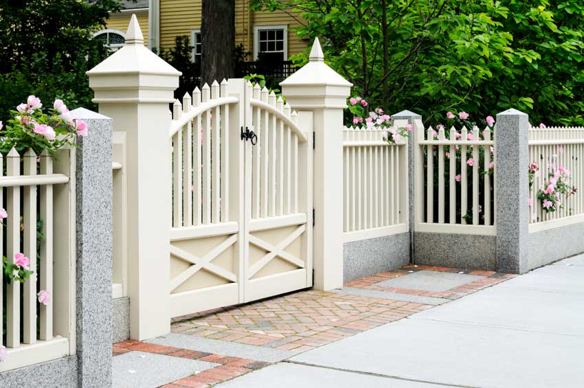 Front area of a residential property with white fence gate