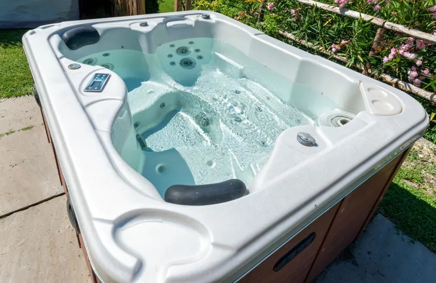 Hot tub with water in it and an Ozonator