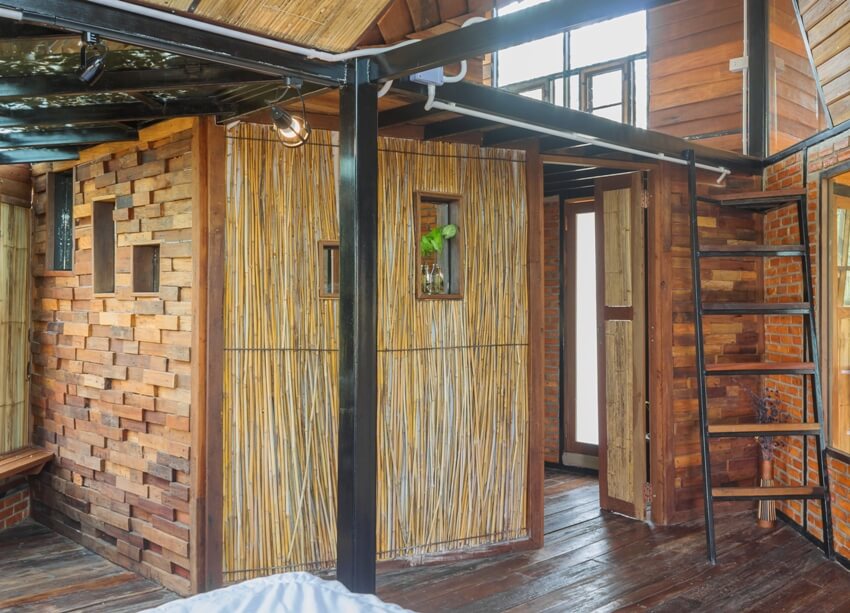 Interior design of a room in country style with bamboo wall panel, wood blocks and slabs