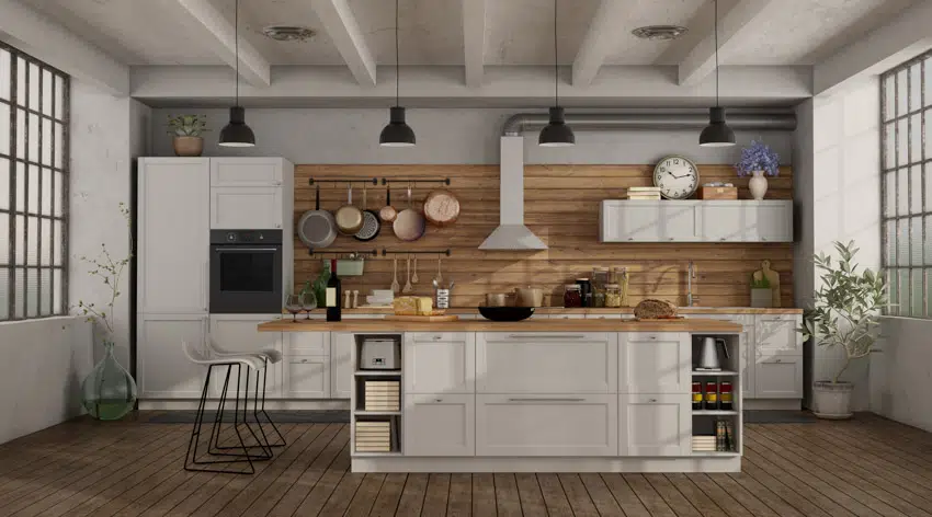 Kitchen with center island, tongue and groove backsplash, wood countertop, pendant lights, wooden floors, range hood, and windows