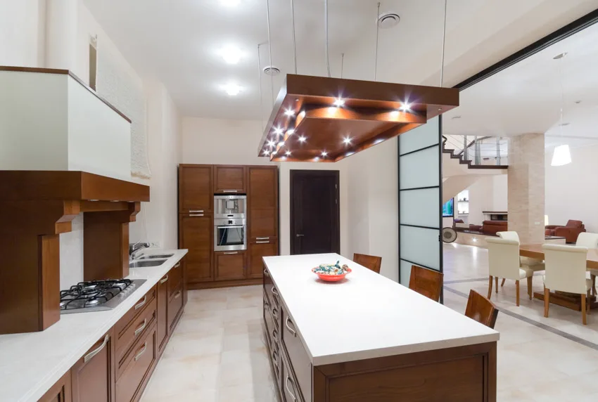 Kitchen with stove, pendant lights and sliding door