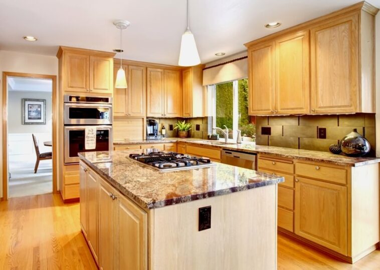 Alder Wood Cabinets Styles How To Update   Kitchen With Hardwood Floor Alder Wood Cabinets Built In Stove On Glossy Granite Island Counter And Stainless Steel Appliances Is 758x539 