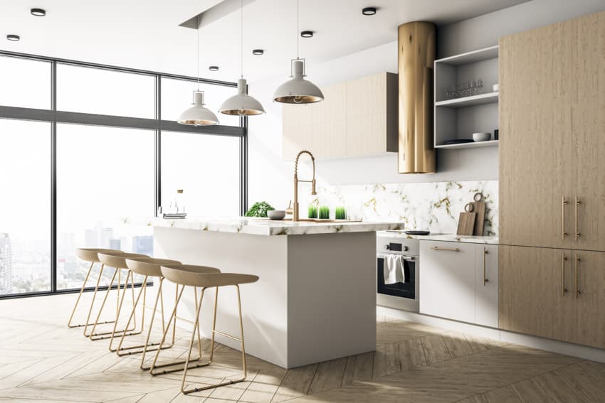 Kitchen with island, stools, pendant lights, range hood, faucet, cabinets, shelves, and windows