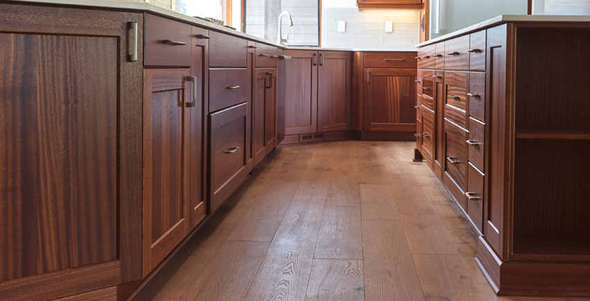 Kitchen with African mahogany cabinets, drawers, and wood floors