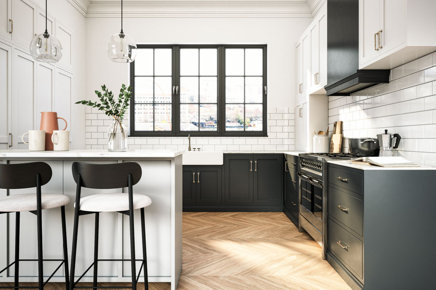 Kitchen with peninsula seating, high chairs, wood floors, black cabinets, tile backsplash, countertops, hanging light, and window