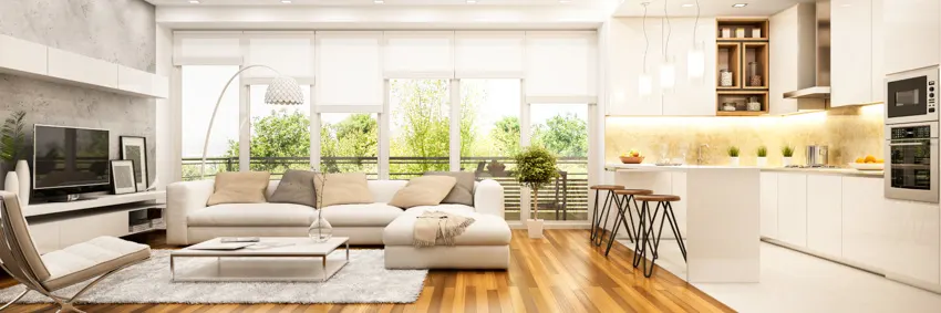 Flat shades on white windows, brown stools and white floor lamp