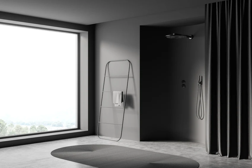 Minimalist bathroom with heavy duty curtain, shower head, rug, and window