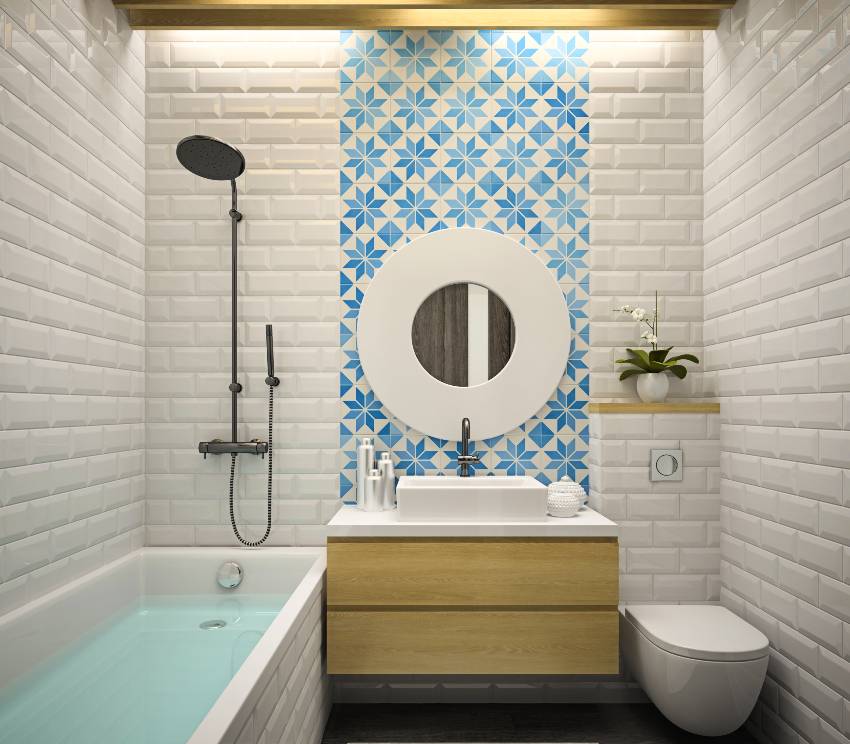 Modern bathroom interior with blue and white design accent wall, bathtub with water and white subway tiles walls