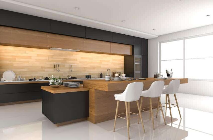 Kitchen with peninsula, black wood surround and under cabinet lighting