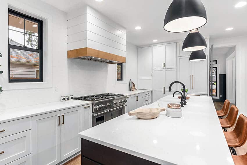 Kitchen with breakfast countertop, island with black finish and single hung windows