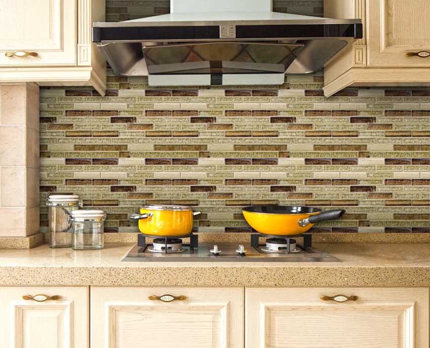 Kitchen with range hood, countertop, cabinets, and peel and stick bamboo backsplash