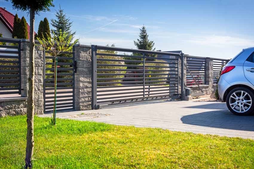 Automatic metal gate, driveway, and car