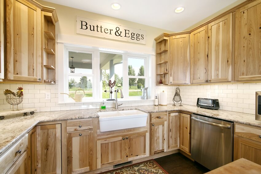 Rustic kitchen with knotty alder wood cabinets and marble countertops