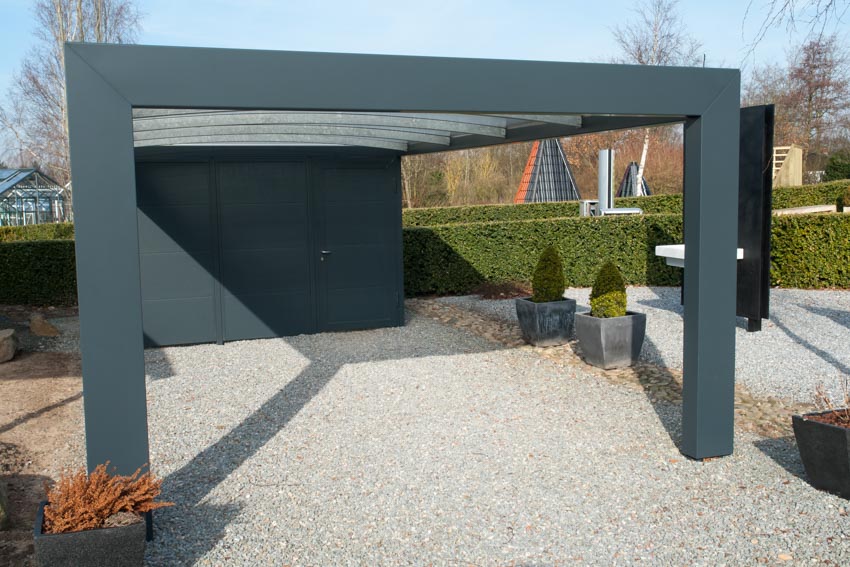 Simple carport design with flat roof, and gravel driveway