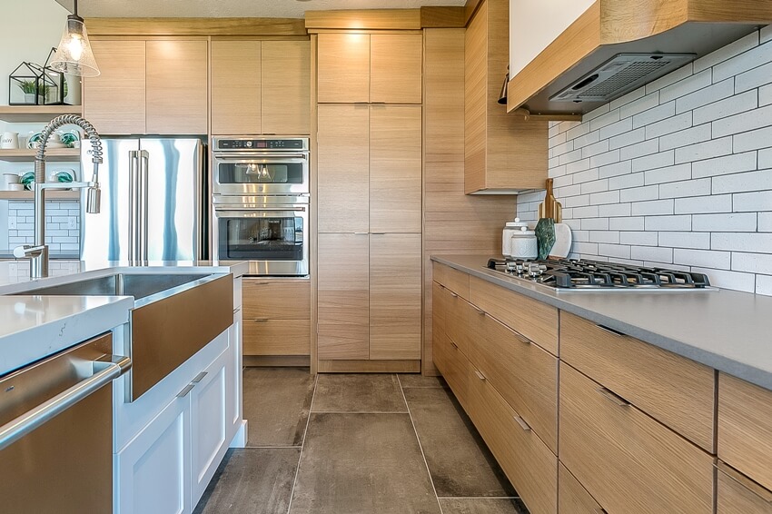 Kitchen with cabinets, stainless steel appliances and basin sink 