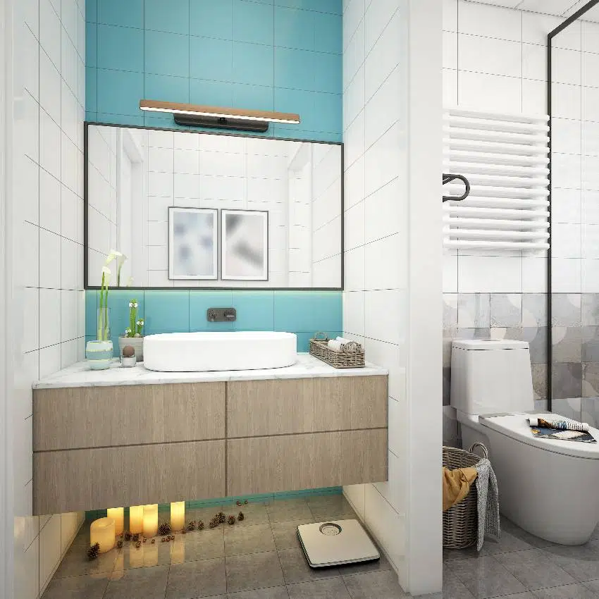 A small bathroom with floor to ceiling paint wall accent, floating countertop and toilet