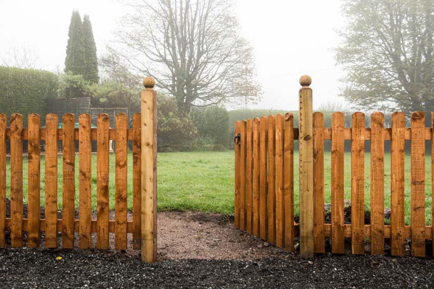 Swing fence gate made of wood planks