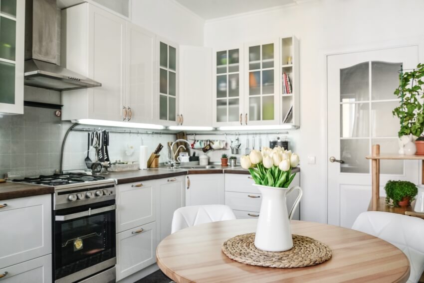 Kitchen with face framed cabinets, stove and steel range