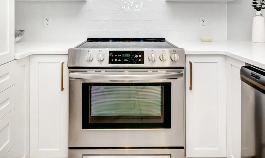Kitchen with steel range with oven