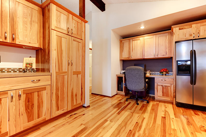 Acacia kitchen flooring and cabinets with desk