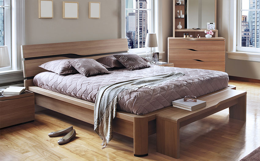 Bedroom with wooden frame, bench, side table and bedside table