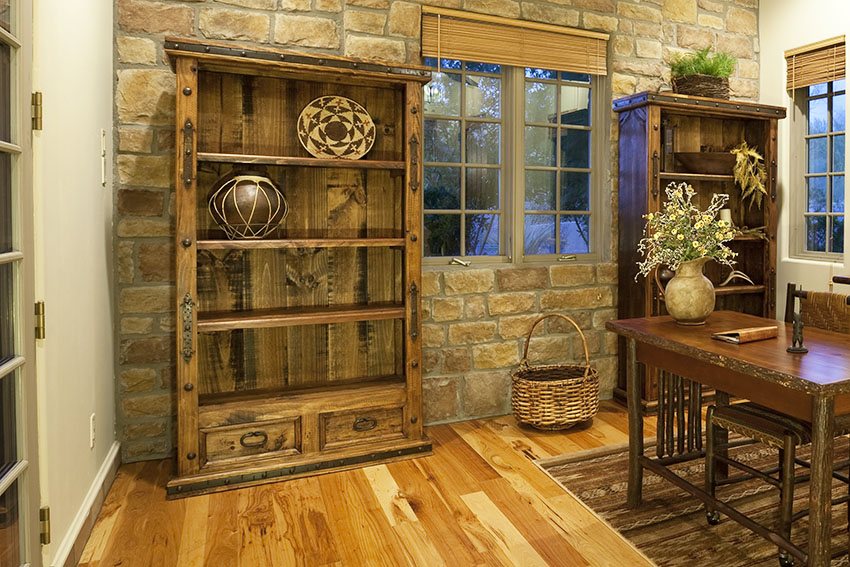 Rustic room with stone wall rustic shelves bamboo blinds
