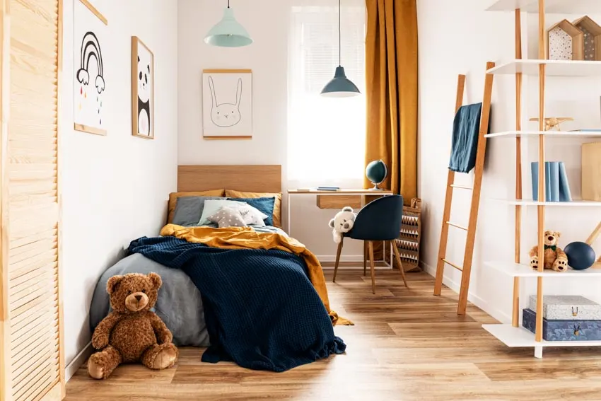Bedroom with small desk, chair, window, curtain, shelves, wood floor, and hanging lights