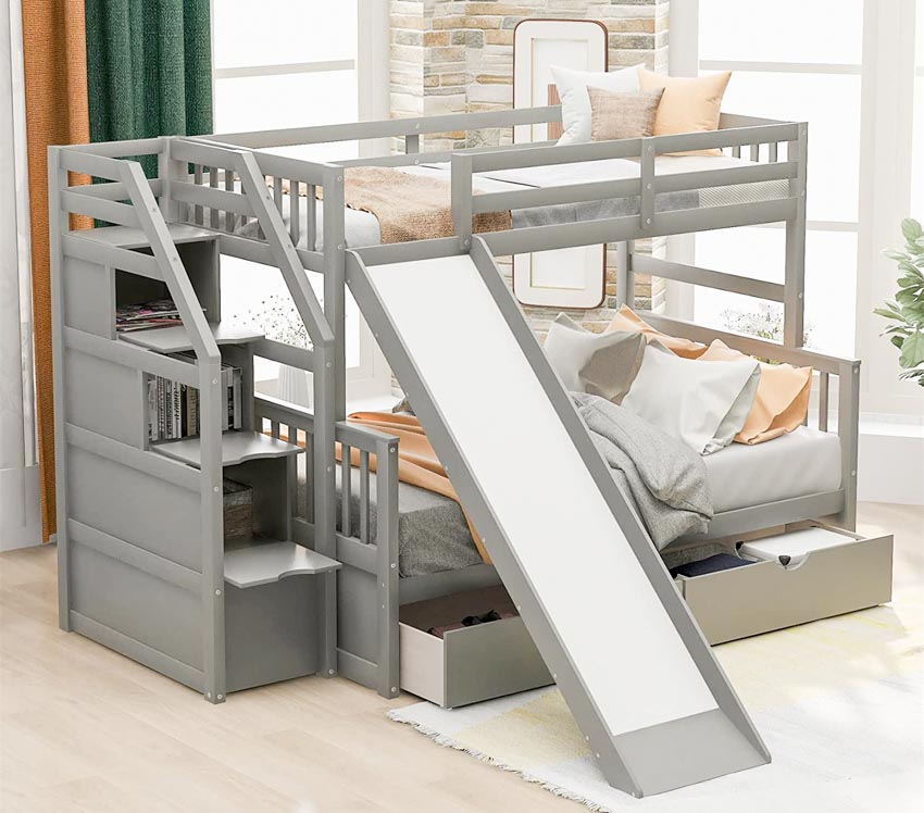 Children's bedroom with bunk bed, slide, storage, pillows, and mattress