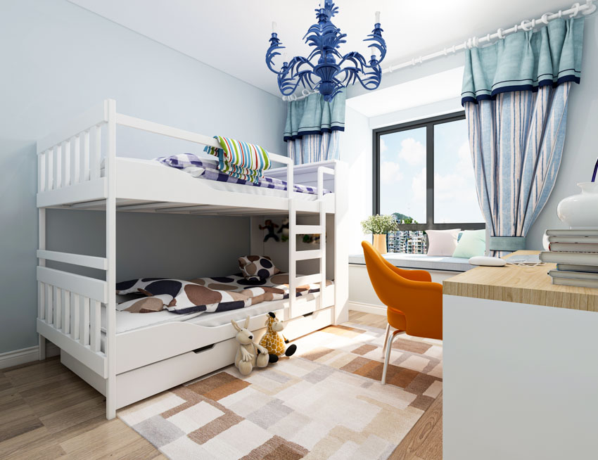 Bedroom with window curtains, bunk, chair, and desk