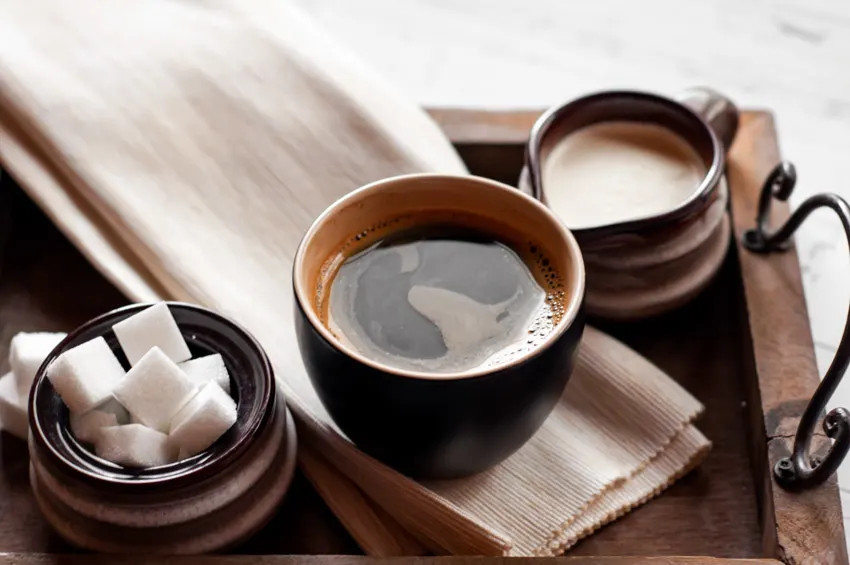 Cup of coffee with cream and sugar set for home coffee bars