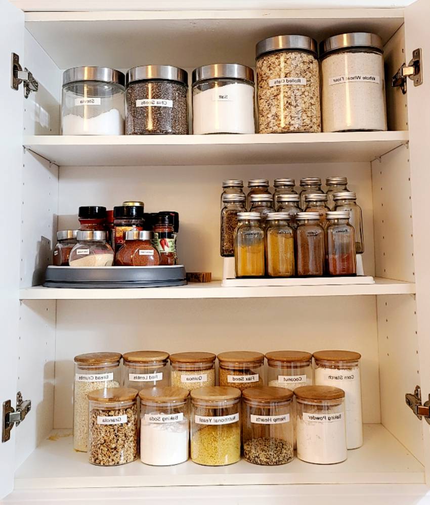 Deep pantry organization with clear containers and labels