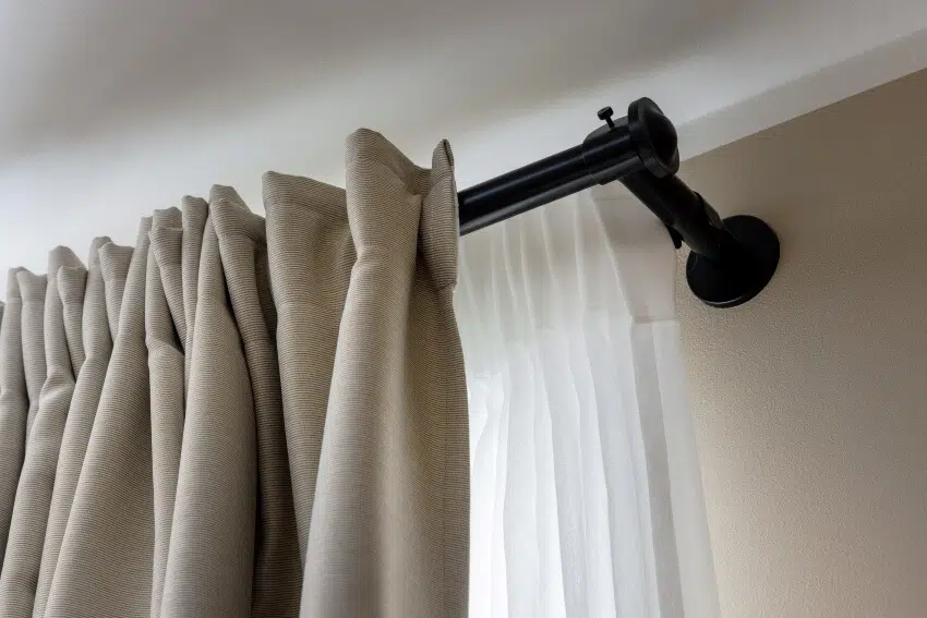 Double layer curtains on black rod