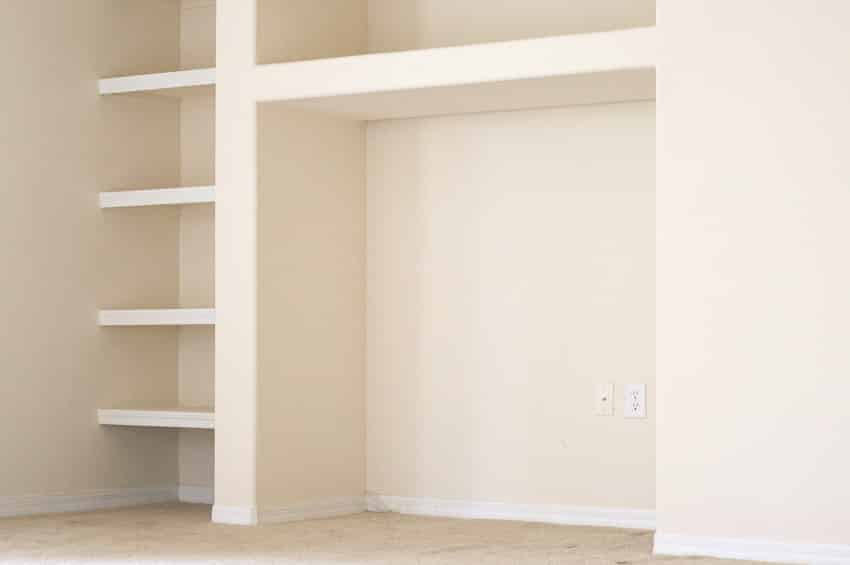 Empty room with cabinet provision and built in shelves
