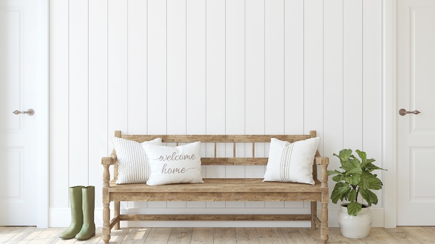 Vertical shiplap with wooen bench and white pillows