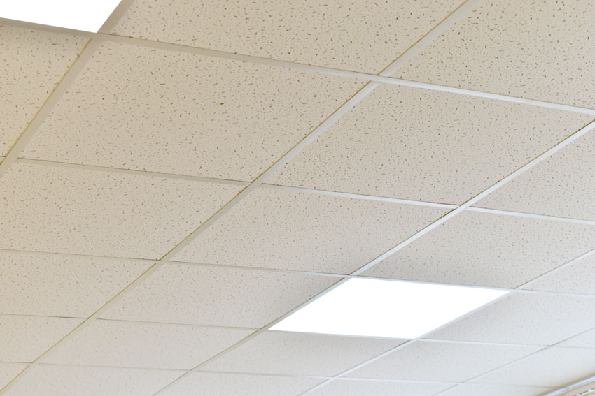 Fiberglass boards on ceiling with lighting fixtures