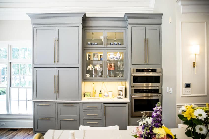 Gray bar, panel cabinets with chrome oven and windows