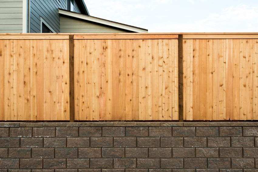 House exterior with raised foundation, and cedar fence planks