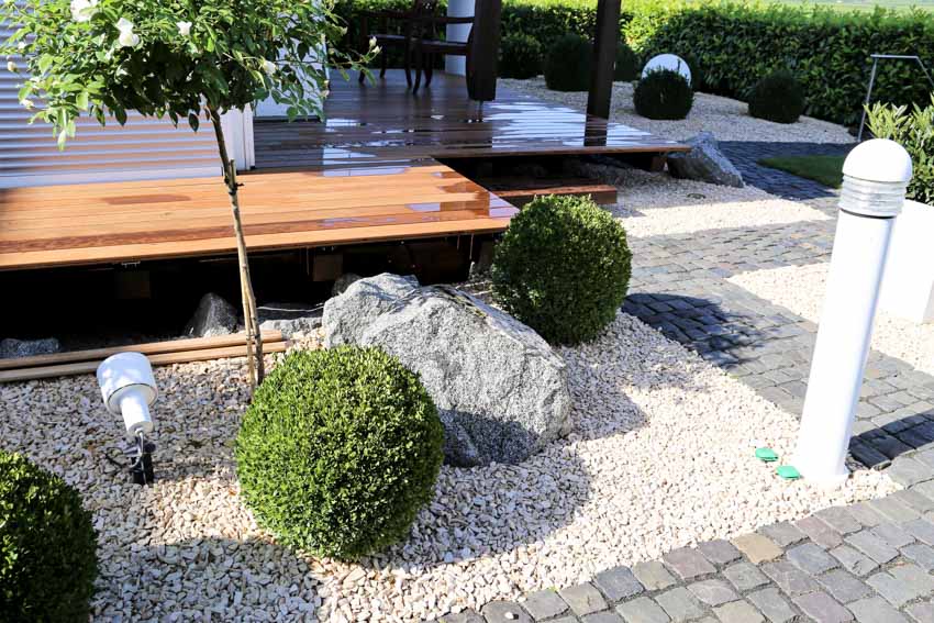 House with ornamental boulder